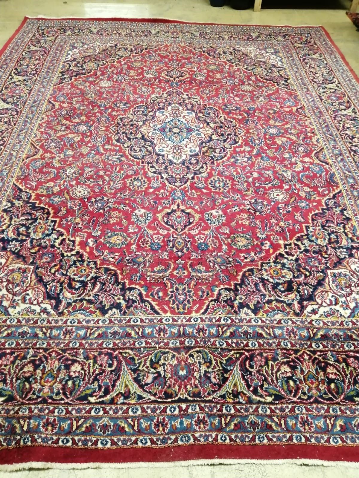 A carpet (worn / damaged), 385 x 295cm